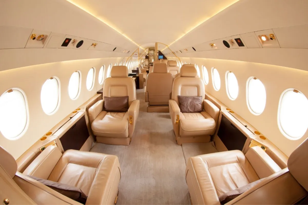 Luxury private jet interior with beige leather seats