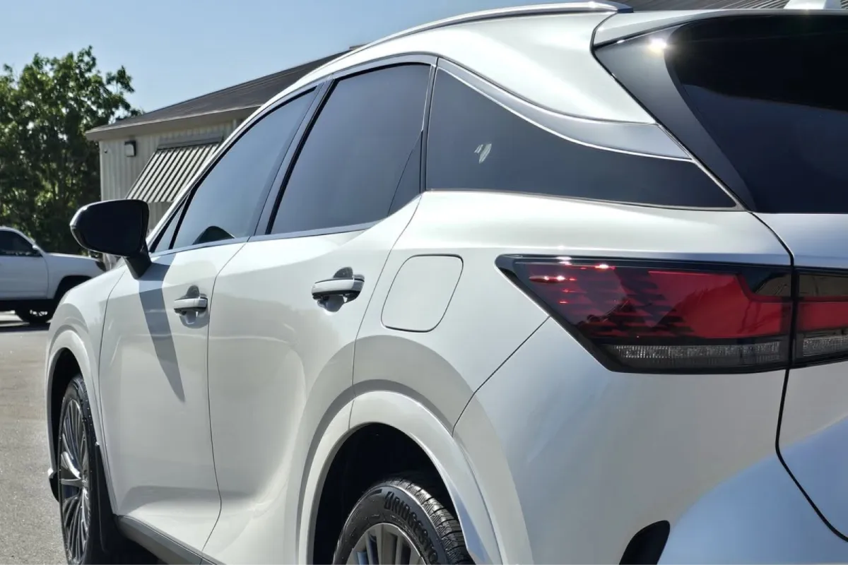White SUV showing completed professional window tint installation.