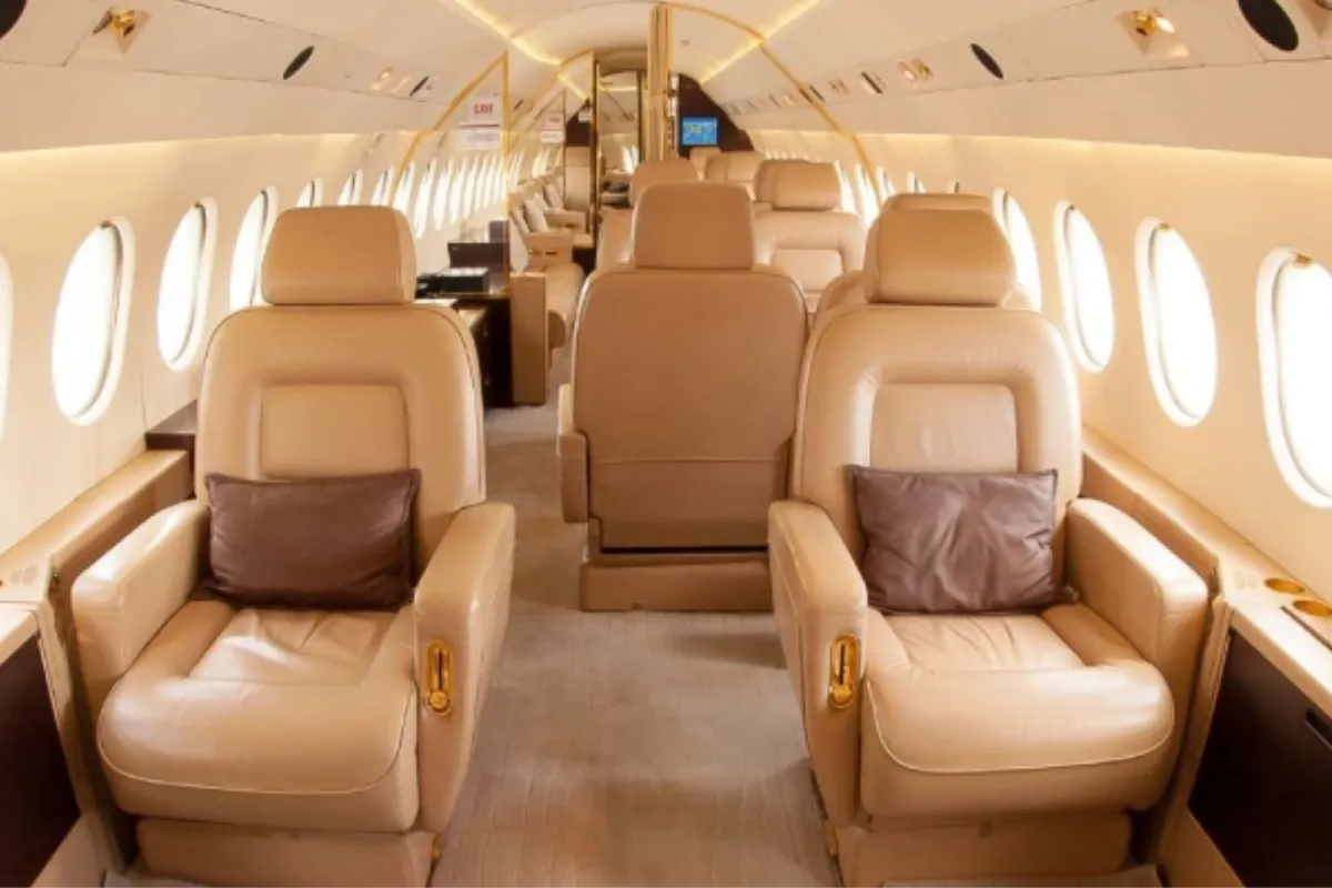 Luxury private jet interior cleaned and detailed with beige leather seats.