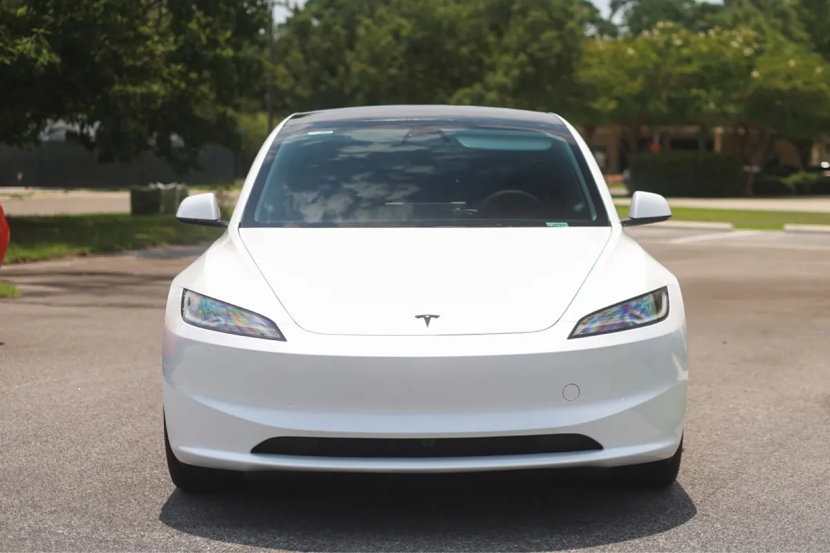 White Tesla Model 3 with professionally tinted windows.
